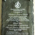 Church of God recognition plaque for community dedication, March 2022. Features names and gratitude message.