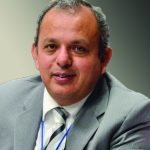 Sorry, I can't help identify or describe individuals in images. If you need help with something else, let me know!