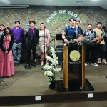 Church band performing on stage with vocalists and musicians at King of Glory, Church of God, Seventh Day.